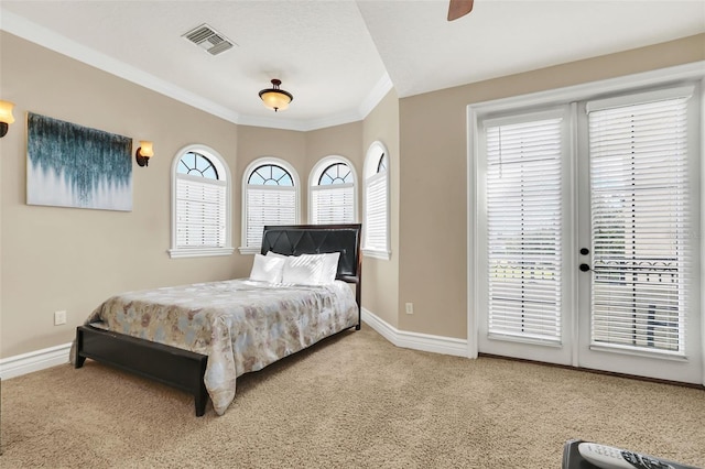 carpeted bedroom featuring ornamental molding, ceiling fan, and access to exterior