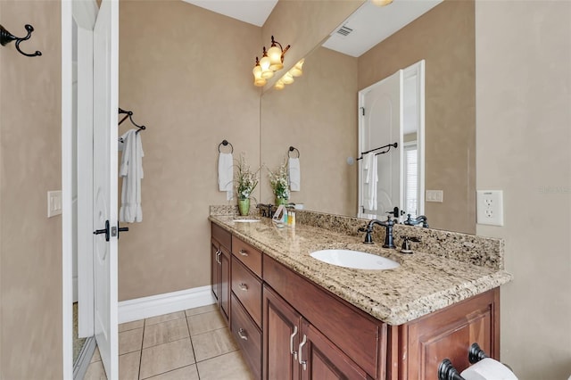 bathroom featuring tile patterned floors and vanity