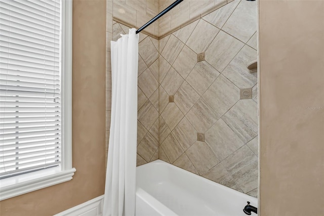 bathroom with shower / bathtub combination with curtain