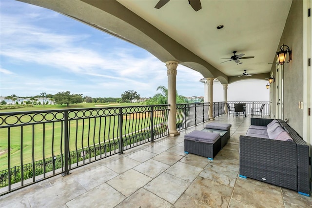 view of patio with a balcony, an outdoor hangout area, and ceiling fan