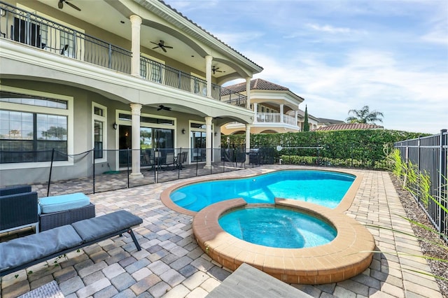 view of pool with a patio, an in ground hot tub, and ceiling fan