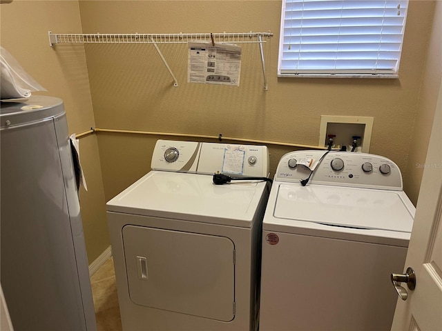 clothes washing area with washer and dryer