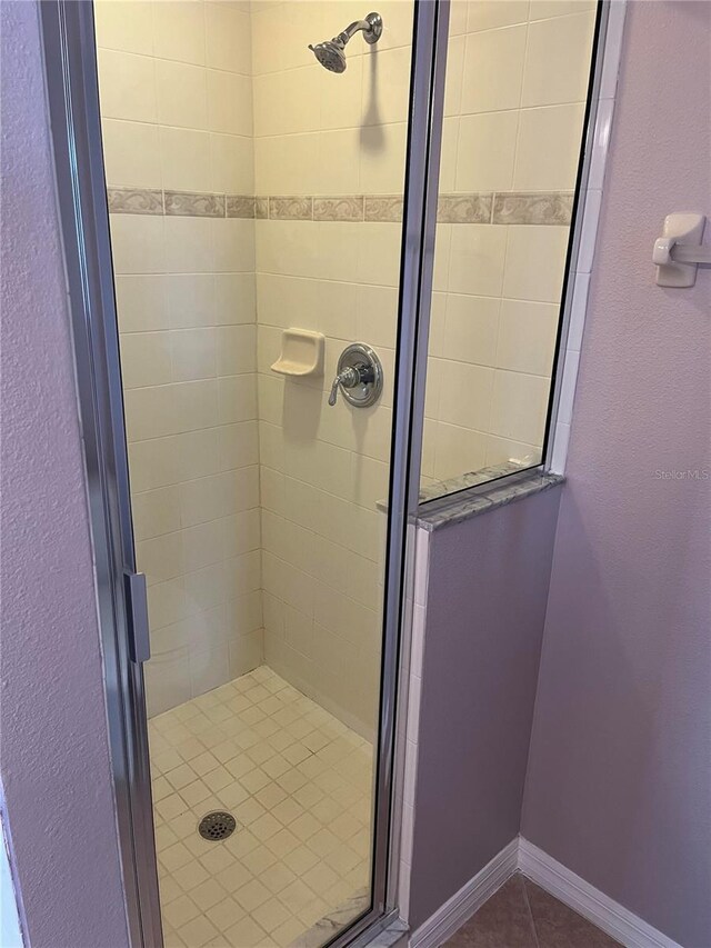 bathroom featuring an enclosed shower