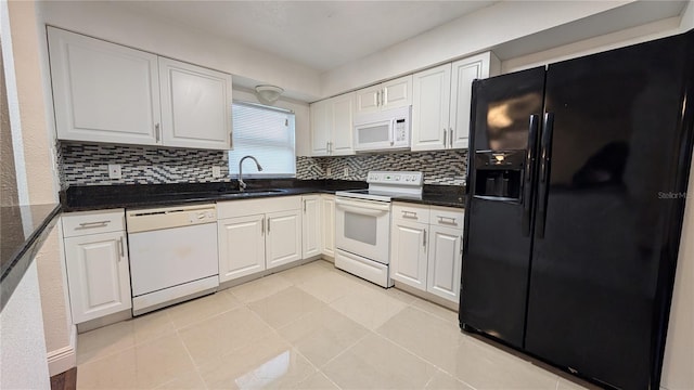 kitchen featuring white cabinetry, sink, and white appliances