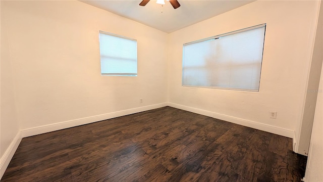 unfurnished room featuring dark hardwood / wood-style floors and ceiling fan