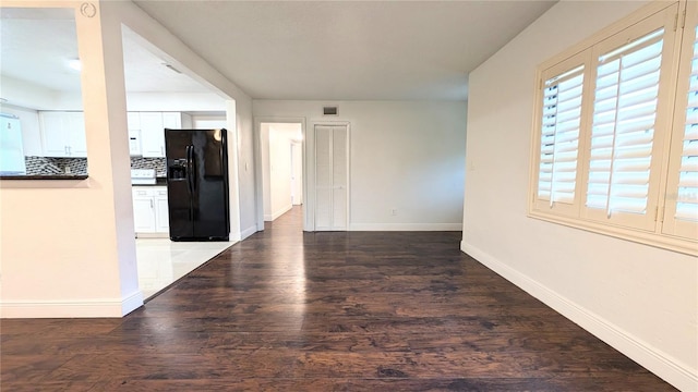 unfurnished room featuring dark hardwood / wood-style floors