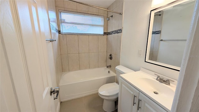 full bathroom with toilet, tiled shower / bath combo, vanity, and tile patterned flooring