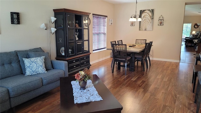 dining space with an inviting chandelier, hardwood / wood-style flooring, and plenty of natural light