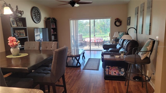 dining area featuring ceiling fan and dark hardwood / wood-style floors