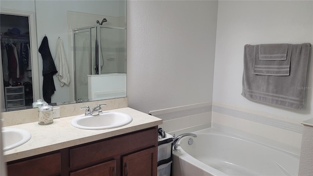 bathroom featuring vanity and separate shower and tub