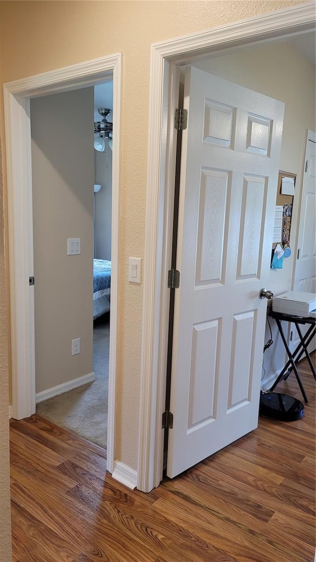 corridor featuring hardwood / wood-style floors