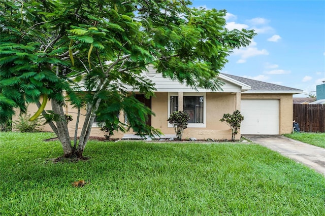 view of front facade with a front lawn and a garage