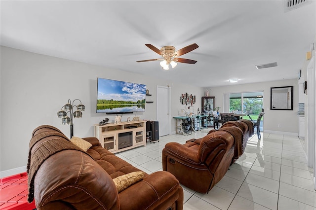 tiled living room featuring ceiling fan