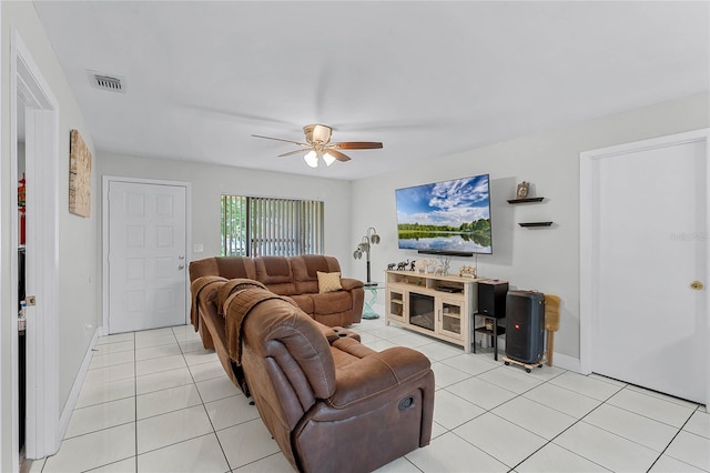 living room with light tile patterned flooring and ceiling fan