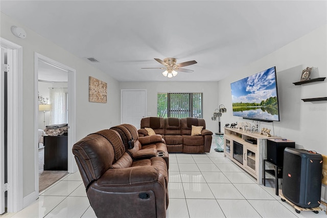 tiled living room with ceiling fan