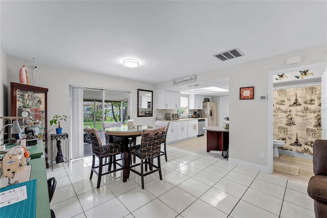 dining space with light tile patterned floors