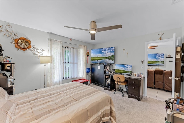 bedroom with light carpet and ceiling fan