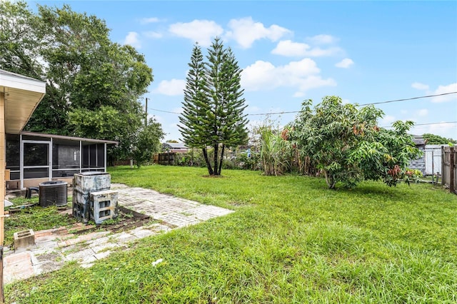 view of yard featuring a patio and cooling unit