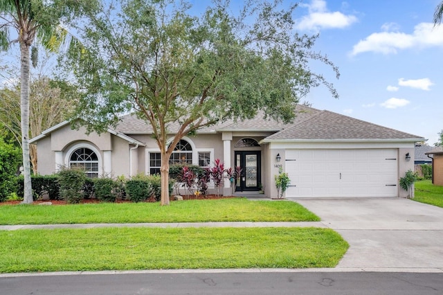 single story home with a front lawn and a garage