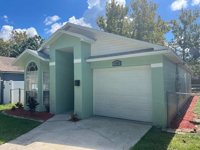 single story home featuring a garage