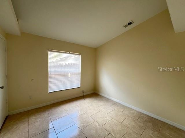 empty room with light tile patterned flooring