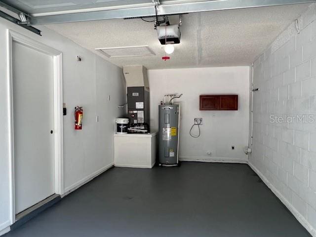 garage featuring electric water heater, heating unit, and a garage door opener