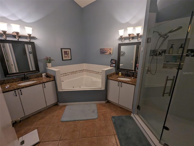 bathroom with tile patterned flooring, vanity, and plus walk in shower