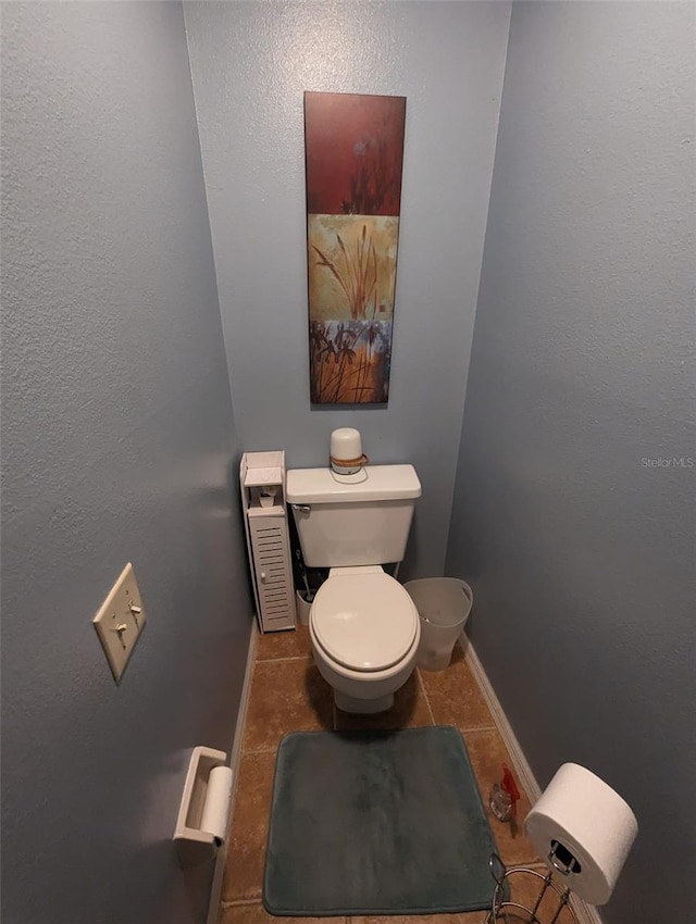 bathroom with tile patterned floors and toilet