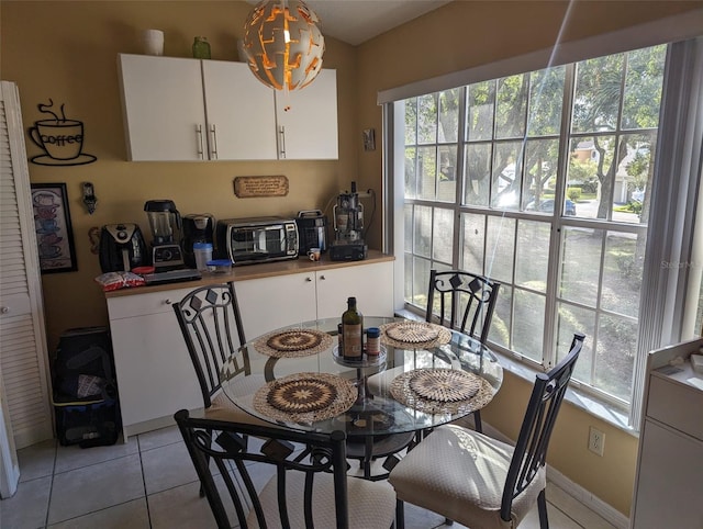 dining space with light tile patterned floors