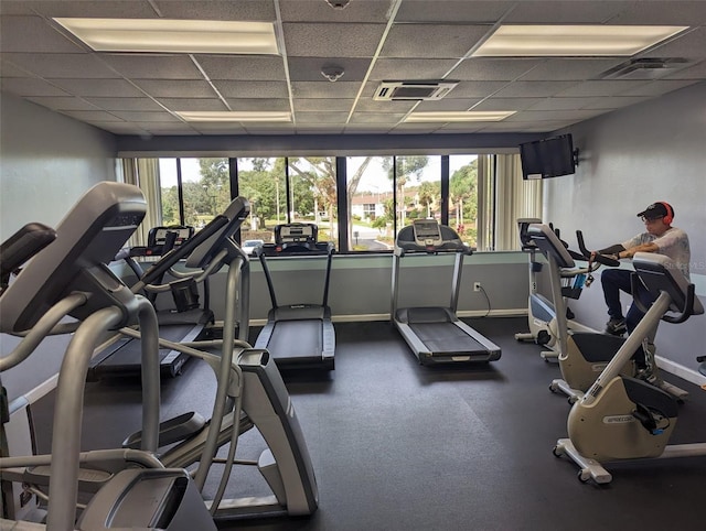 workout area with a drop ceiling