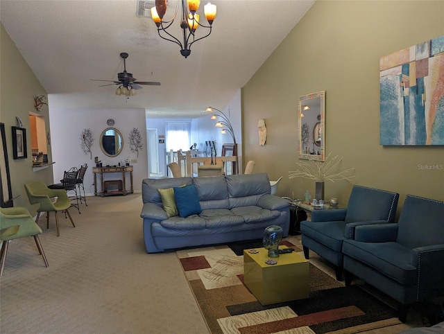 carpeted living room featuring lofted ceiling and ceiling fan with notable chandelier