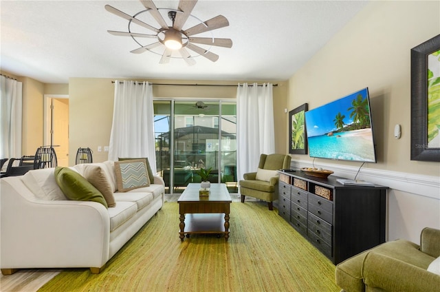 living room featuring light hardwood / wood-style flooring and ceiling fan