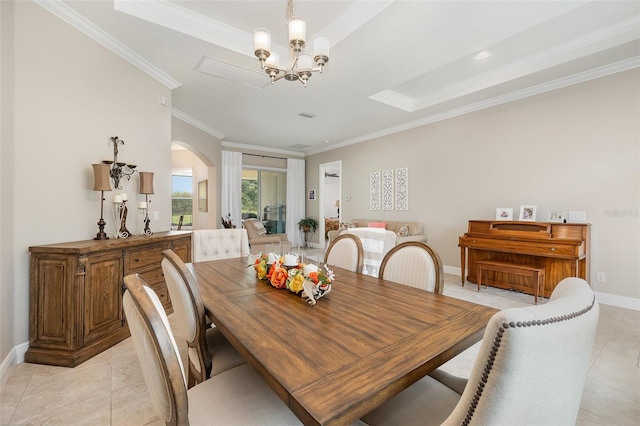 dining space featuring an inviting chandelier, light tile patterned flooring, and crown molding