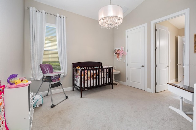 bedroom with light carpet, a nursery area, and lofted ceiling