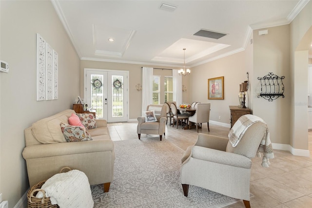 living room with light tile patterned flooring, crown molding, french doors, and an inviting chandelier