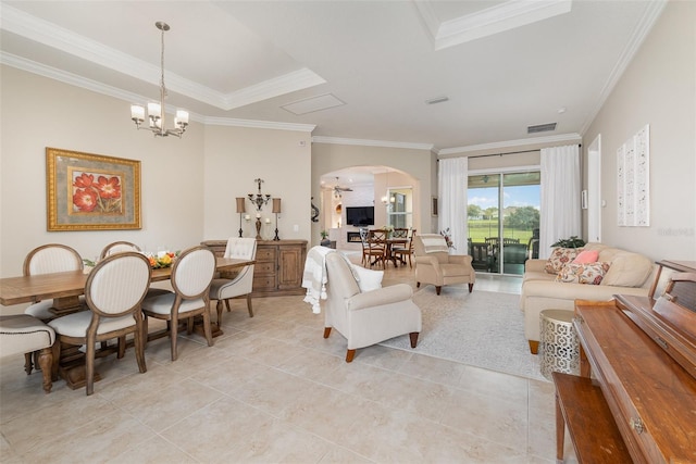 tiled living room with an inviting chandelier and crown molding