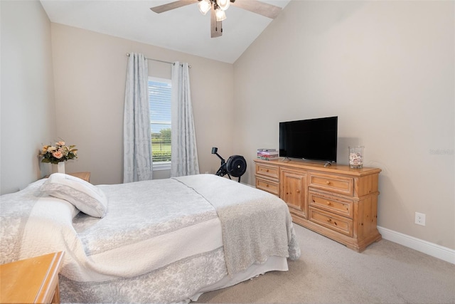 bedroom featuring lofted ceiling, ceiling fan, and light colored carpet