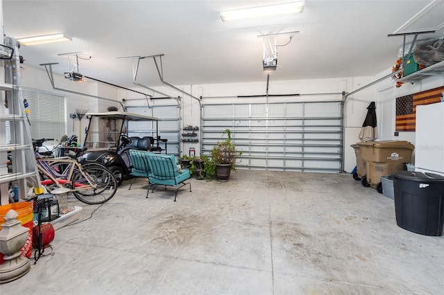 garage featuring a garage door opener