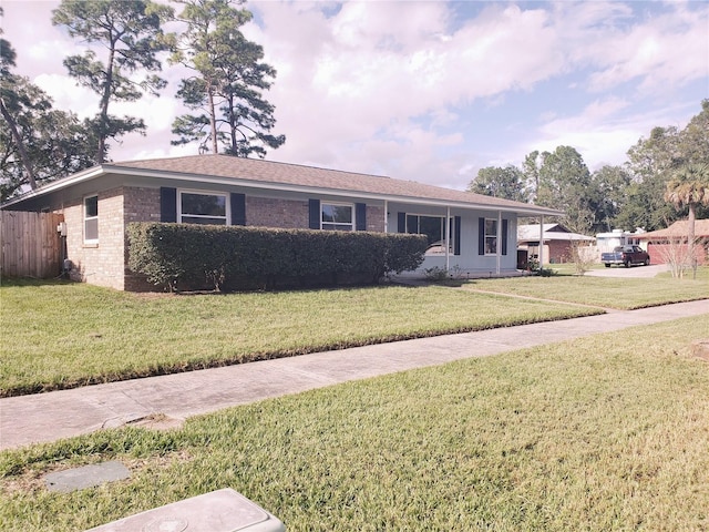 single story home with a front yard