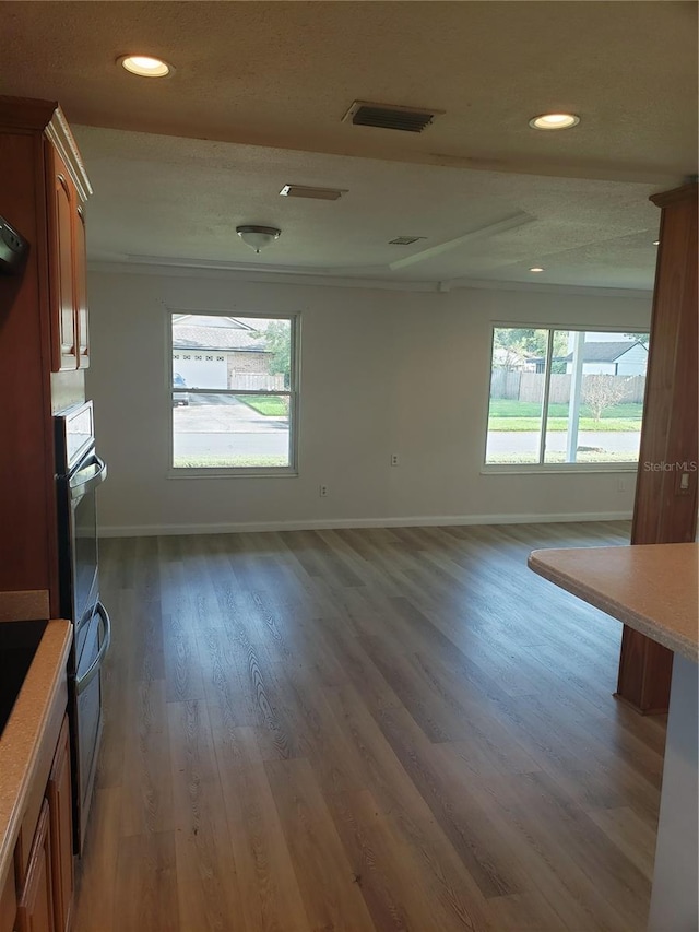 unfurnished living room with dark wood-type flooring