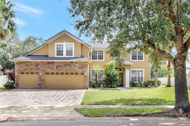 view of front of house featuring a front yard and a garage