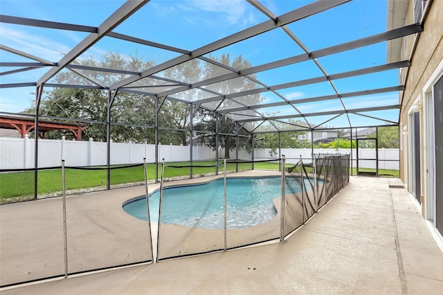 view of pool with a yard, a lanai, and a patio area