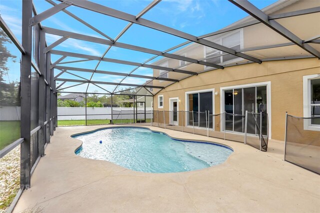 view of pool with a lanai and a patio area