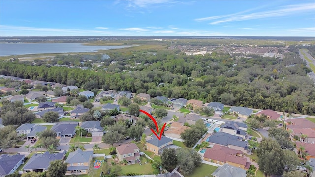 birds eye view of property featuring a water view