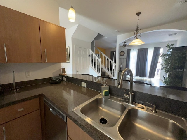 kitchen with hanging light fixtures, dishwasher, ceiling fan, and sink