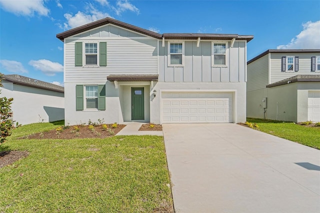 view of front of home featuring a front lawn and a garage