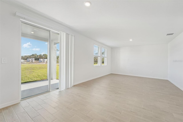 spare room featuring light wood-type flooring