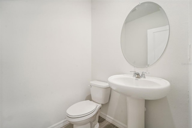 bathroom with sink and toilet