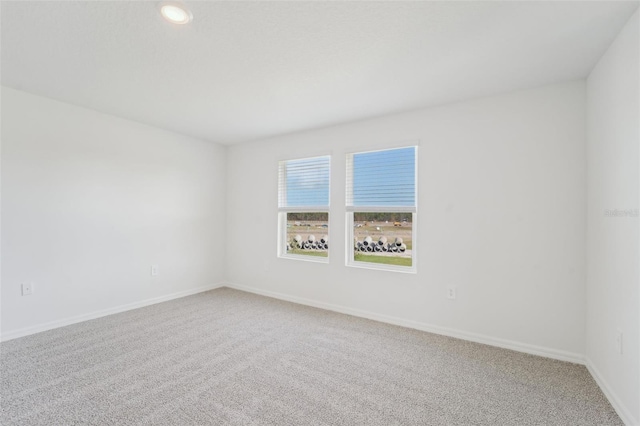 empty room with carpet flooring