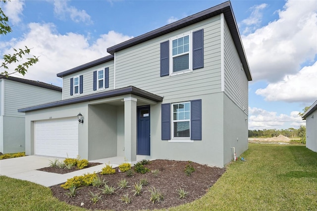 view of front of home featuring a garage and a front lawn